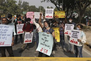 Indian students shout slogans demanding the release of Dalit labor rights activists Nodeep Kaur and Shiv Kumar and climate activist Disha Ravi during a protest in New Delhi, India, Monday, Feb.15 2021.