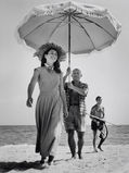 Pablo Picasso and Françoise Gilot. In the background the painter's nephew Javier Vilato. Golfe-Juan, France. 