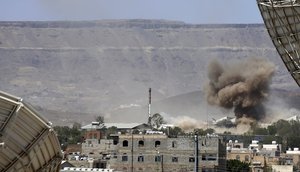 In this Sept. 9, 2015 file photo, smoke rises after an airstrike by the Saudi-led coalition on an army base in Sanaa, Yemen