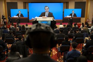 Wang Yi speaks during a remote video press conference held on the sidelines of the annual meeting of China's National People's Congress