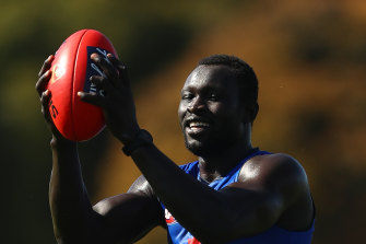 Majak Daw joins the Demons for their training session at Casey Fields on Tuesday.