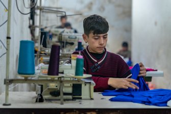 Ahmad works as a tailor in a small pyjama factory in Aleppo, Syria, from 8am to 8pm six days a week.