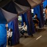 HONG KONG, CHINA - MARCH 13: Residents receive mandatory COVID-19 test by health worker in an area under lockdown on Robinson Road at night in the mid-levels neighborhood on March 13, 2021 in Hong Kong, China. Four residential blocks in mid-levels were locked down for mandatory COVID-19 testing following a recent surge in new cases, caused by a super-spreader at a gym after cluster grew to 99 confirmed cases. (Photo by Anthony Kwan/Getty Images)