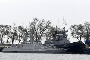 In this Monday, Nov. 26, 2018 file photo, three Ukrainian ships are docked near the Kerch after been seized on Sunday, in Kerch, Crimea.