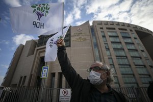 Supporters of Turkey's pro-Kurdish Peoples' Democratic Party (HDP) protest in front of a courthouse in Istanbul, Wednesday, Feb. 3, 2021, where former party co-chairman Selahattin Demirtas is being tried on charges of insulting former prime minister Ahmet Davutoglu.