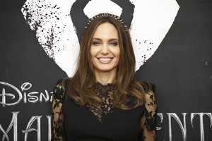 Actress Angelina Jolie poses for photographers at the photo call for the film 'Maleficent Mistress of Evil' in central London, Thursday, Oct. 10, 2019.