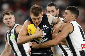 Cripps is tackled against Collingwood