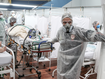 Medical staff members transport a patient on a stretcher at the Pedro DellAntonia Sports Complex field hospital as coronavirus cases soar on March 11, in Santo Andre, Brazil. (Alexandre Schneider/Getty Images South America/Getty Images)