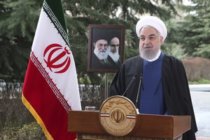 In this photo released on Saturday March 20, 2021 by the official website of the office of the Iranian Presidency, President Hassan Rouhani delivers a message for the Iranian New Year, or Nowruz, in Tehran, Iran.