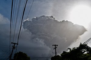 Ash rises into the air as La Soufriere volcano erupts on the eastern Caribbean island of St. Vincent, seen from Chateaubelair, Friday, April 9, 2021