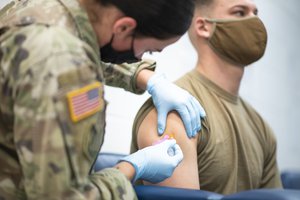 The Wyoming Army National Guard’s Medical Detachment administers the new Moderna vaccine to select members at the Raper Armory, Wyoming Army National Guard, Cheyenne, Wyo., Jan. 6, 2021