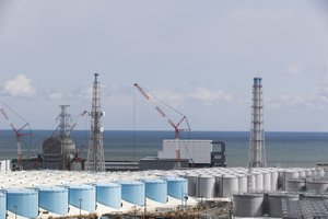 The Pacific Ocean looks over nuclear reactor units of No. 3, left, and 4 at the Fukushima Daiichi nuclear power plant in Okuma town, Fukushima prefecture, northeastern Japan, Saturday, Feb. 27, 2021