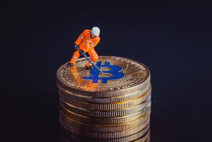 Miner working on a golden Bitcoin