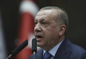 Turkish President Recep Tayyip Erdogan, addresses the members of his ruling party in Parliament, in Ankara, Turkey, Wednesday, March 11, 2020