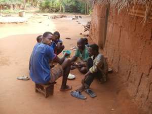 We are in a small village in the prefecture of Yoto.Situé 80 kilometers from the capital Lome  sous une case en train de  manger               Nous sommes dans un petit un village situé dans la préfecture de Yoto.Situé à 80 kilomètres de Lomé la capitale