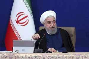 In this photo released by the official website of the office of the Iranian Presidency, President Hassan Rouhani speaks in a cabinet meeting in Tehran, Iran, Wednesday, April 14, 2021.