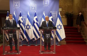 Israeli Prime Minister Benjamin Netanyahu delivers a statement with the Greek Prime Minister Kyriakos Mitsotakis after their meeting in the Prime Minister's office in Jerusalem on February 8, 2021. (Photo by menahem kahana / POOL / AFP)