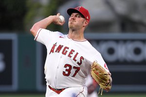 Los Angeles Angels starting pitcher Dylan Bundy throws to the plate during the second inning of a baseball game against the Texas Rangers Monday, April 19, 2021