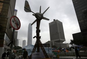 A wind power device set up by pro-democracy protesters is seen in an occupied area outside government headquarters in Hong Kong's Admiralty district in Hong Kong Saturday, Nov. 8, 2014.