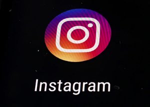 In this Thursday, Nov. 29, 2018, photo, the Instagram app logo is displayed on a mobile screen in Los Angeles.