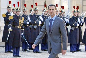 In this Thursday Dec. 9, 2010 file photo, Syria President Bashar al-Assad arrives at the Elysee Palace in Paris for his meeting with French President Nicolas Sarkozy.