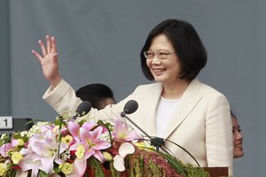 Taiwan's President Tsai Ing-wen waves to Taiwanese people before delivering an acceptance speech during her inauguration ceremonies in Taipei, Taiwan, Friday, May 20, 2016.