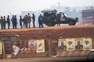 In this Thursday, Jan. 14, 2021 file photo, security forces gather on election day in Kampala, Uganda.