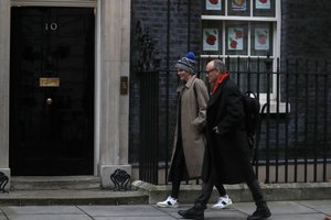 File - Dominic Cummings, right, Chief Adviser to Britain's Prime Minister Boris Johnson, and Cleo Watson, a government adviser, arrive in Downing Street in London, Friday, Nov. 13, 2020.