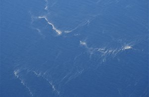 Oil slicks are seen in the area where the search operation for submarine KRI Nanggala that went missing while participating in a training exercise on Wednesday is conducted, in this aerial photo taken from a maritime patrol aircraft of 800 Air Squadron of the 2nd Air Wing of Naval Aviation Center (PUSPENERBAL) over the waters off Bali Island, Indonesia, Thursday, April 22, 2021.