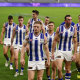 Kangaroos players leave the field after their loss against Fremantle at a closed Optus Stadium on the weekend. 