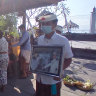 Relatives carry a portrait of Captain Gede Kartika, one of the junior officers of Indonesian Navy submarine KRI Nanggala that sank in Celukan Bawang, Bali, Indonesia. 