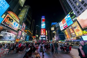 File - Times Square is a major commercial intersection, tourist destination, entertainment center, and neighborhood in the Midtown Manhattan section of New York City, at the junction of Broadway and Seventh Avenue.