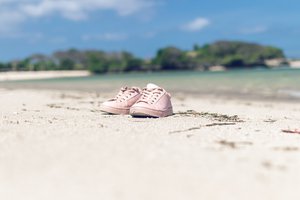 Shoes on a tropical beach of Bali island