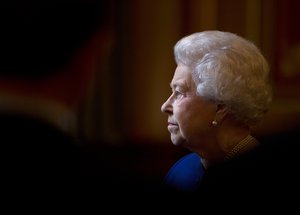 Britain's Queen Elizabeth II escorted by British Foreign Secretary William Hague, unseen, tours The Foreign and Commonwealth Office