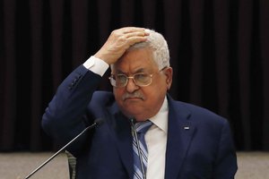 In this Aug. 18, 2020 file photo, Palestinian President Mahmoud Abbas gestures during a meeting with the Palestinian leadership, in the West Bank city of Ramallah. Egyptian officials said late monday, April 26, 2021, that the Palestinian Authority plans to call off its first elections in 15 years, citing Israel's refusal to allow voting in east Jerusalem.