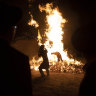 Ultra-Orthodox Jewish youths stand next to a bonfire in Jerusalem, to mark the Lag Ba’Omer holiday, marking the end of a plague said to have decimated Jews during Roman times. 