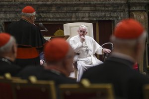 File - In this Dec. 21, 2019 file photo, Pope Francis listens to Cardinal Angelo Sodano, standing at left with back to camera, as he delivers his speech on the occasion of the pontiff's Christmas greetings to the Roman Curia, in the Clementine Hall at the Vatican.