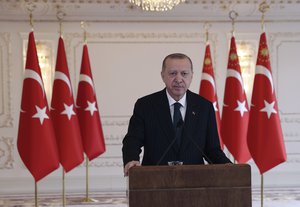 Turkey's President Recep Tayyip Erdogan speaks to his ruling party members during a video conference, in Istanbul, Saturday, Dec. 12, 2020