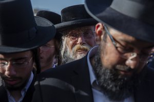 Mourners attend the funeral of a person who died during Lag BaOmer celebrations at Mt. Meron in northern Israel, in Jerusalem on Friday, April 30, 2021.