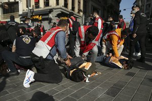 Police officers detain protesters after they tried to push through a police barricade blocking access towards Taksim Square in central Istanbul during May Day protests, Saturday, May 1, 2021.