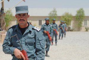 Afghan National Police recruits in the Basic Patrolman course practice a patrol formation at the Regional Training Center-Kandahar, May 15, 2011, in Kandahar, Afghanistan