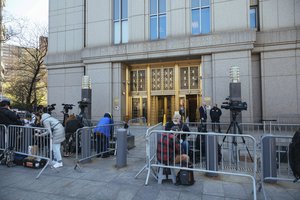 Members of the press congregate during Ghislaine Maxwell's appearance in Federal Court on Friday, April. 23, 2021, in New York