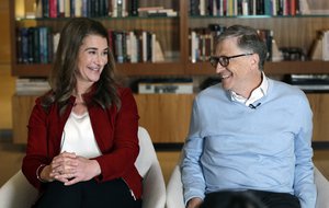 Bill and Melinda Gates smile at each other during an interview in Kirkland, Wash.