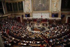 Parliament members listen to French Prime Minister Edouard Phillippe during an emergency debate in France's National Assembly over the fuel protests in Paris, Wednesday Dec.5, 2018