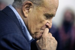 In this Monday, Oct. 12, 2020, file photo, former New York Mayor Rudy Giuliani pauses while addressing supporters of President Donald Trump during a Columbus Day gathering at a Trump campaign field office in Philadelphia.