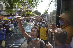 Anti-coup protesters shout slogans during a demonstration on Thursday May 6, 2021 in Yangon, Myanmar. More than 200 global organizations urged the U.N. Security Council on Wednesday to impose an arms embargo on Myanmar