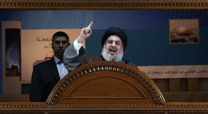 File - Hezbollah leader Sheik Hassan Nasrallah speaks during a rally to mark Jerusalem day or Al-Quds day, in a southern suburb of Beirut, Lebanon, Friday, Aug. 2, 2013.