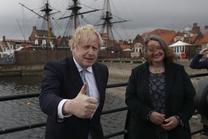 British Prime Minister Boris Johnson poses for photographers with Jill Mortimer, the winning Conservative Party candidate of the Hartlepool by-election, at Hartlepool Marina, in Hartlepool, north east England, Friday, May 7, 2021.