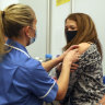 A woman receives the Moderna COVID-19 vaccine in Reading, England.