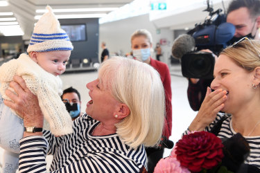 The Age, News, 19/04/2022, photo by Justin McManus
First flights in the Australia and New Zealand travel bubble.
Grandmother Janet Callaghan meets grandson 3 month old Finn for the first time with along with Janet’s daughter Jo Mangos.